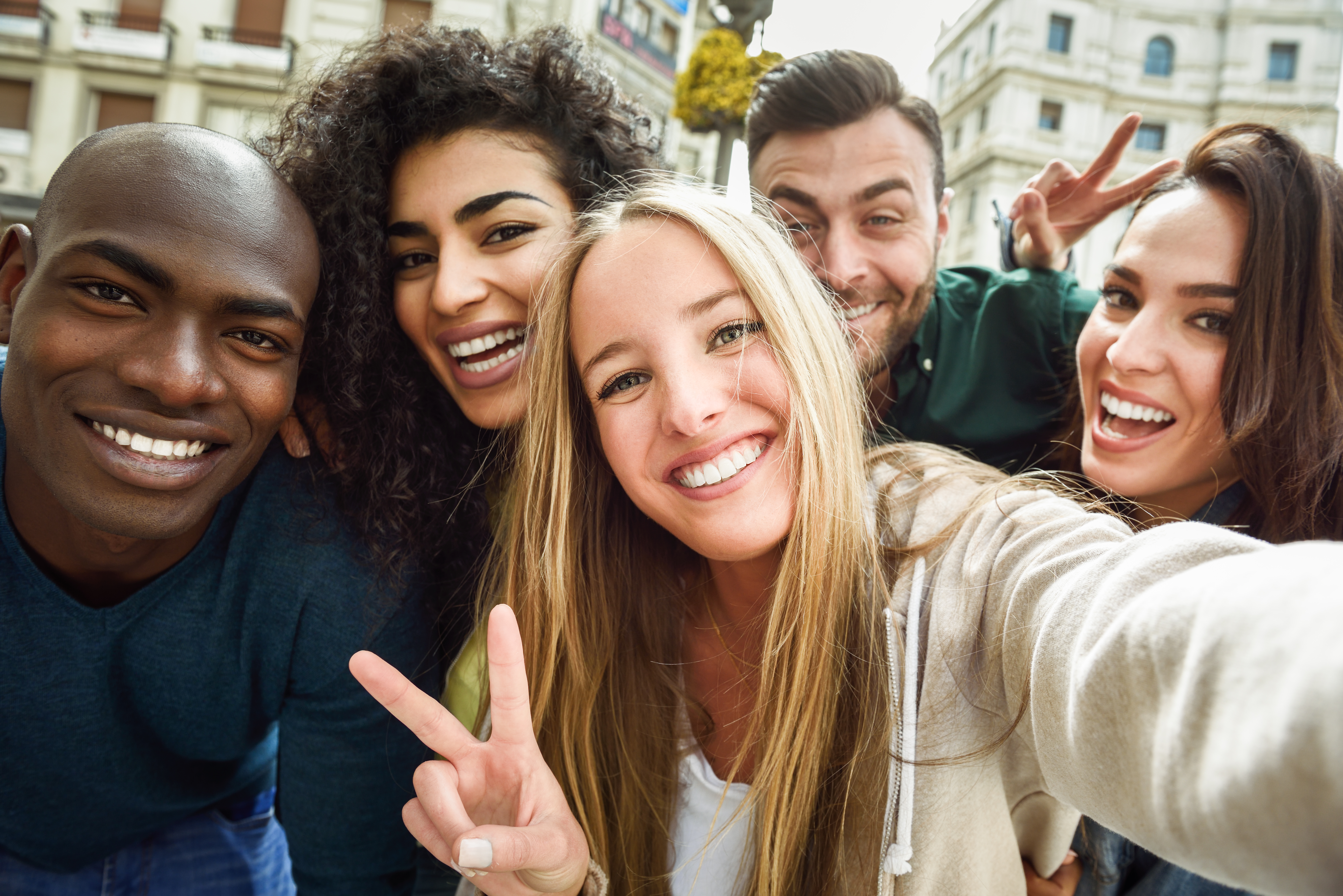 multiracial-group-of-young-people-taking-selfie